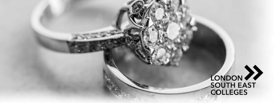 close-up image of a diamond engagement ring and wedding ring