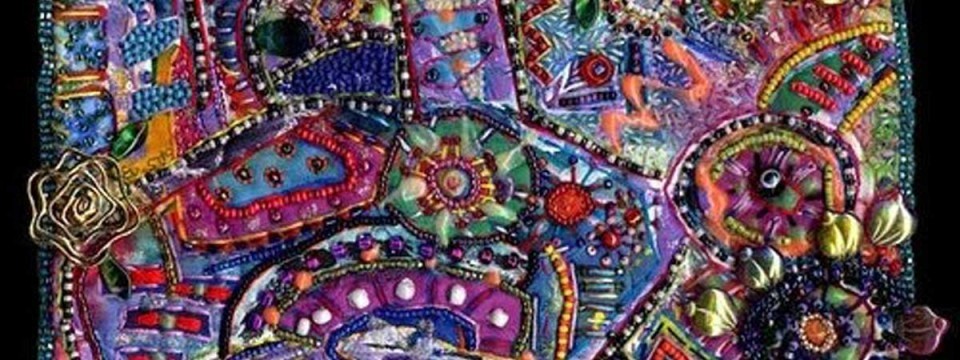 close-up of a piece of stitched and embellished fabric