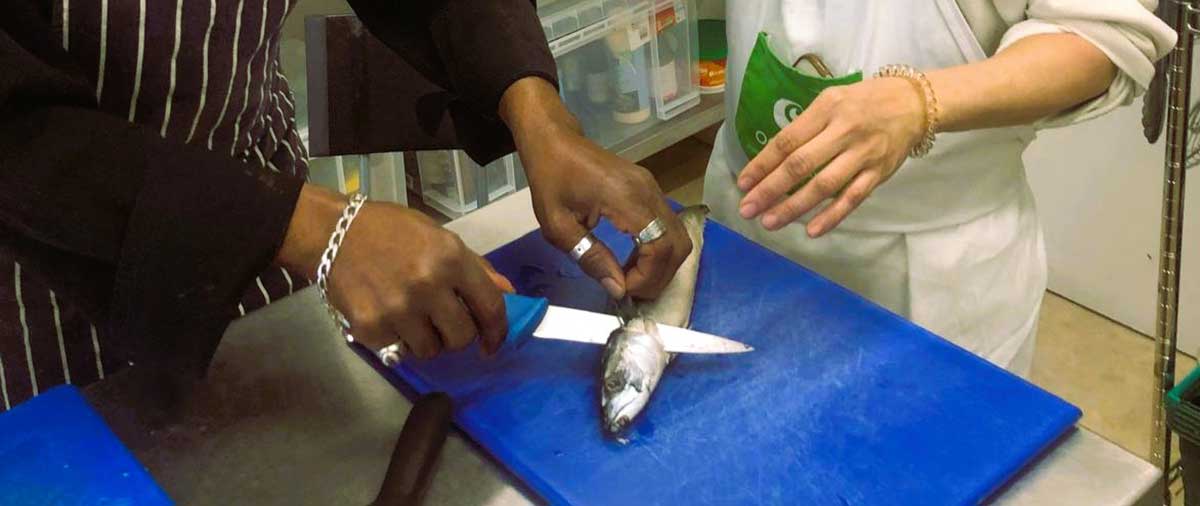 Student learning knife skills