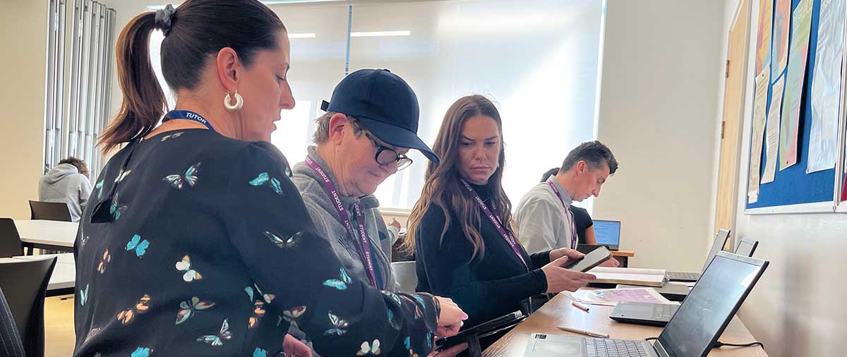 Tutor teaching student digital skills