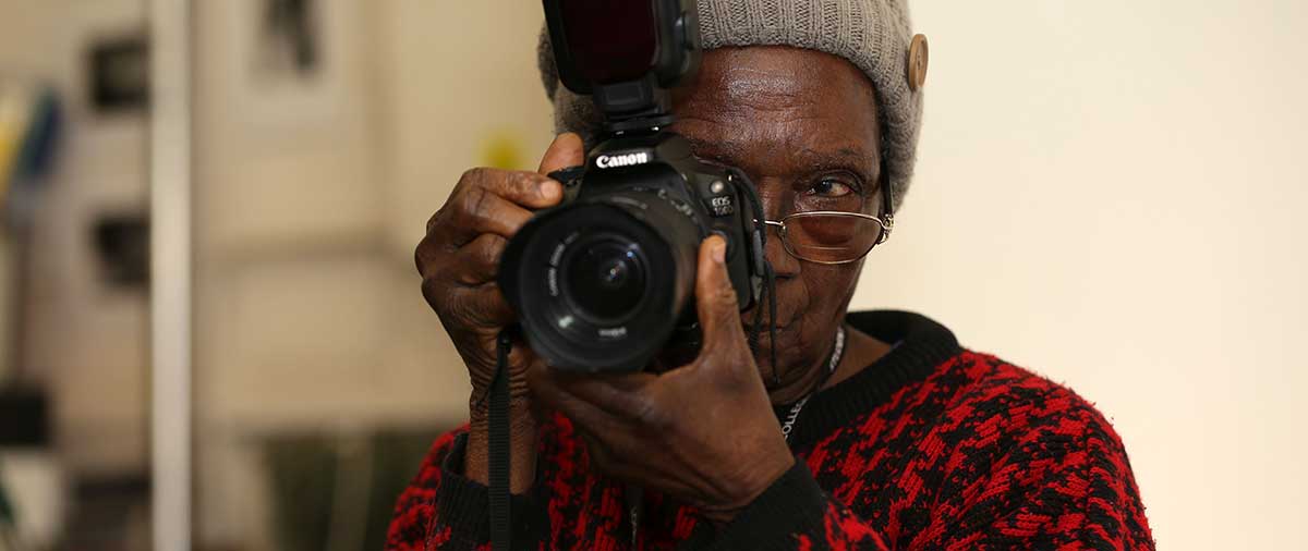 Photography student learning to use an SLR camera