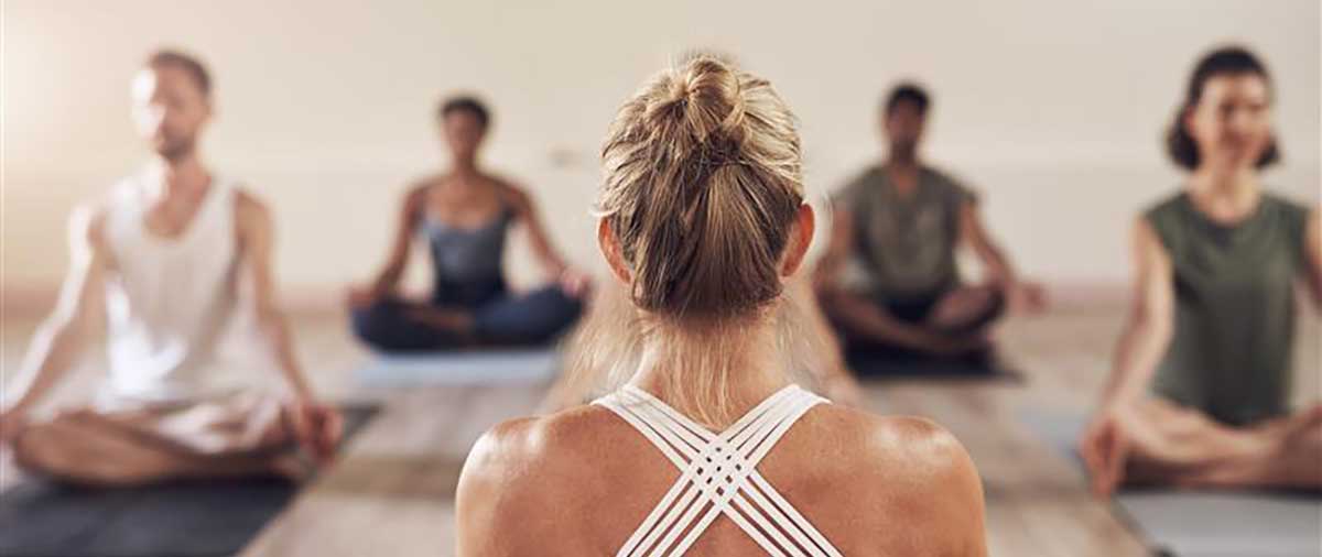 Yoga class in progress to improve wellbeing and mental health